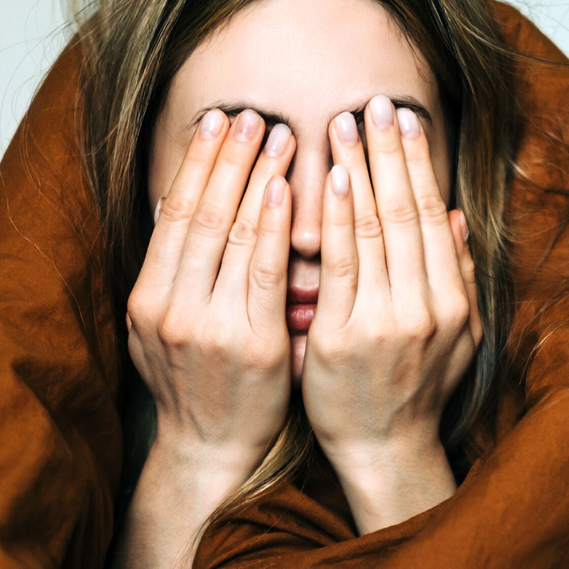 A woman hid under her duvet feeling guilty