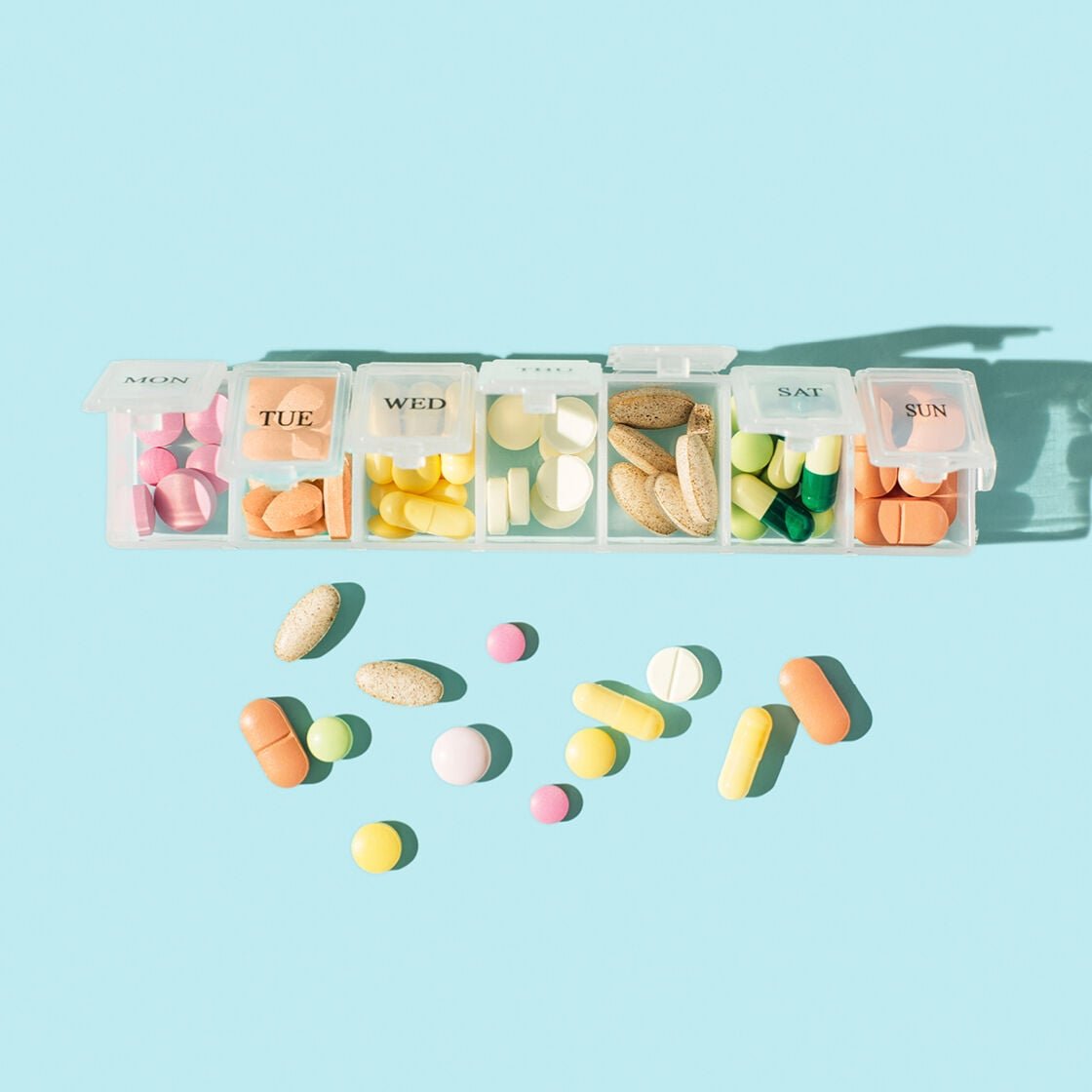 Pill box full of supplements