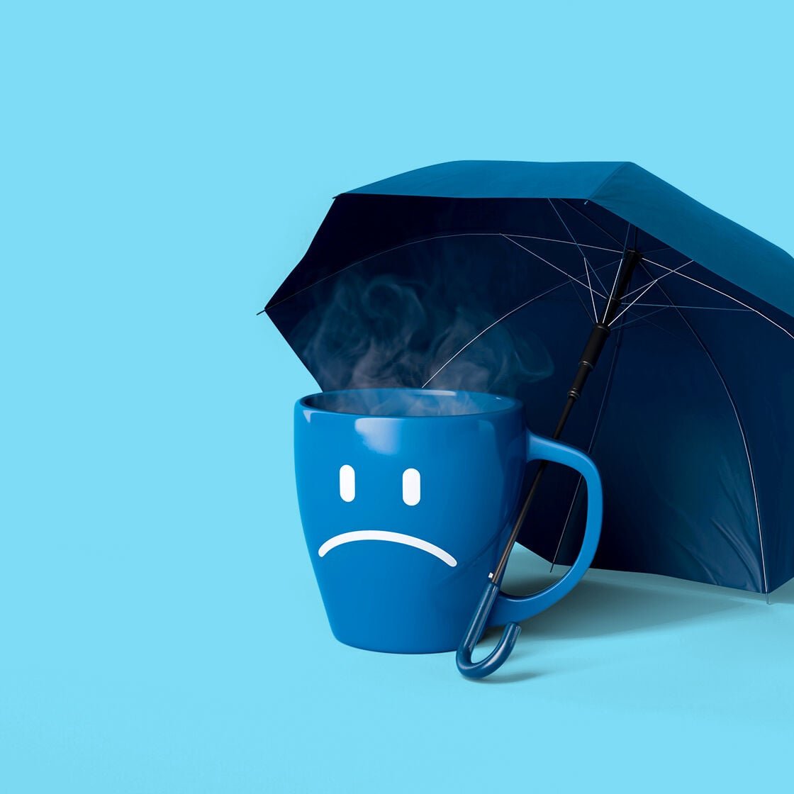 An umbrella over a steaming mug