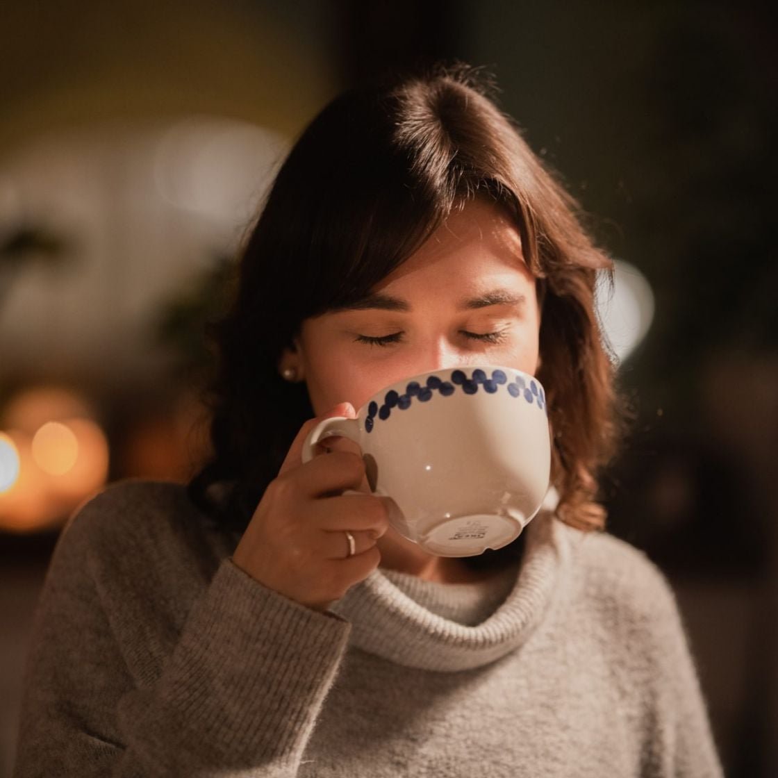 Woman drinking from a mug