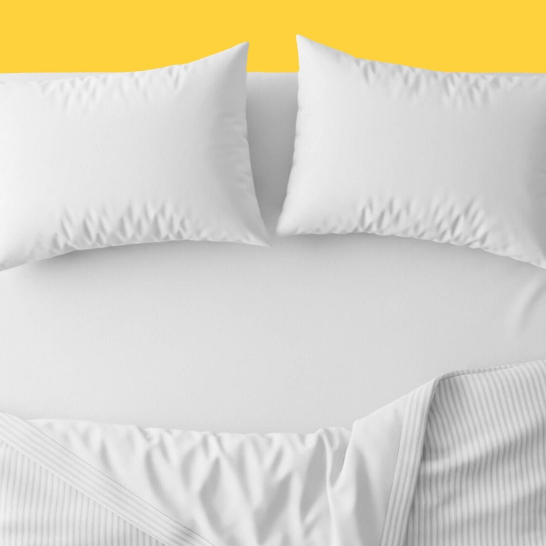 A bed with a yellow background