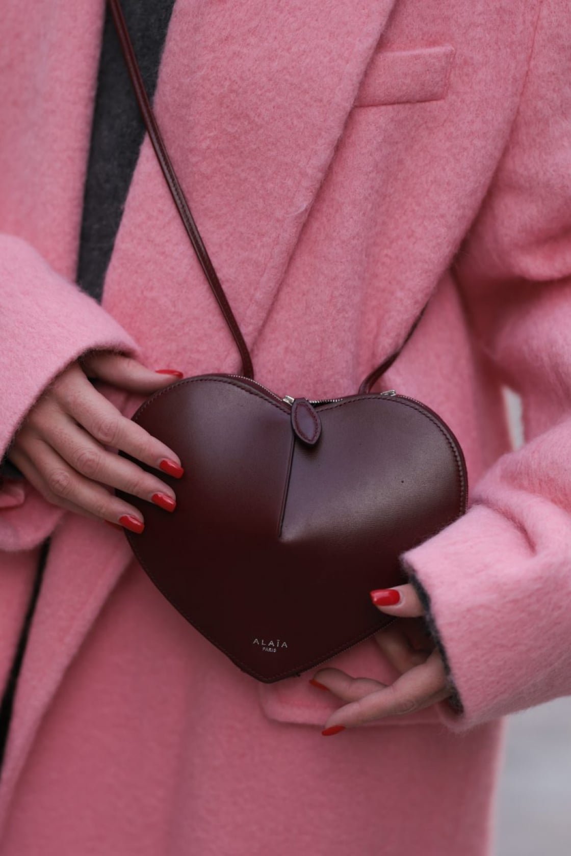 Street style wearing heart bag