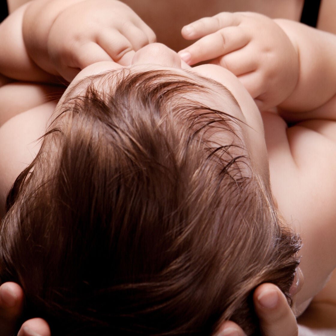 mother holding newborn baby