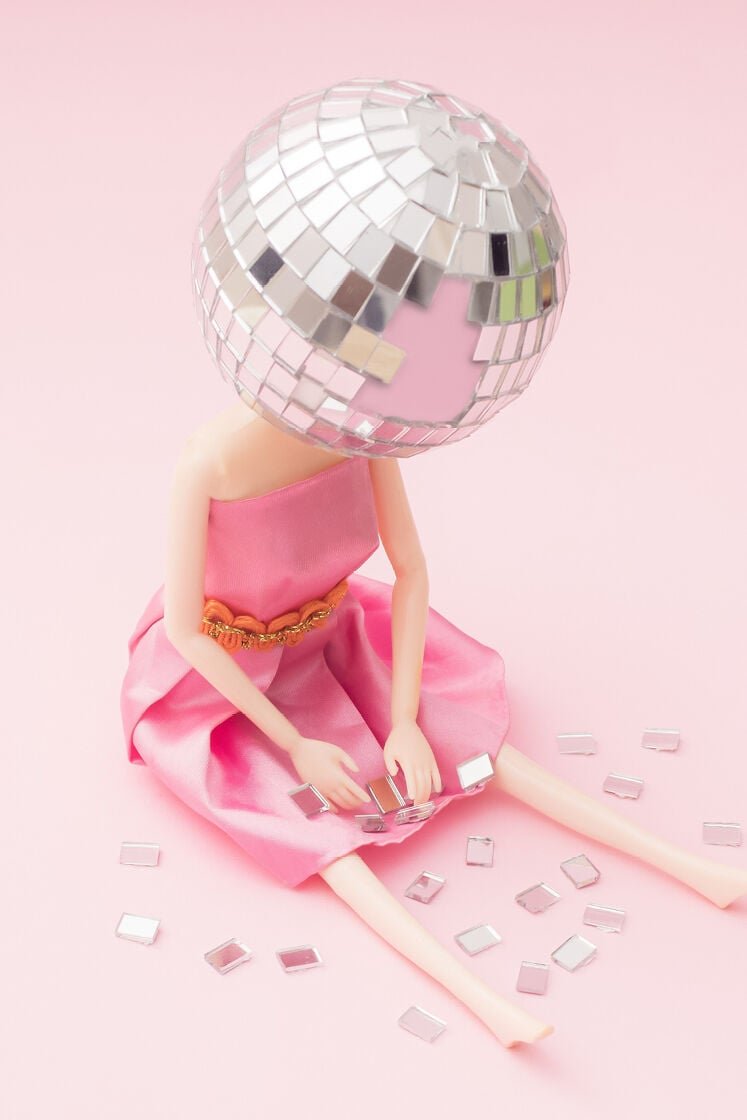 barbie doll with mirror disco ball on head - end of year spiral, new year's eve