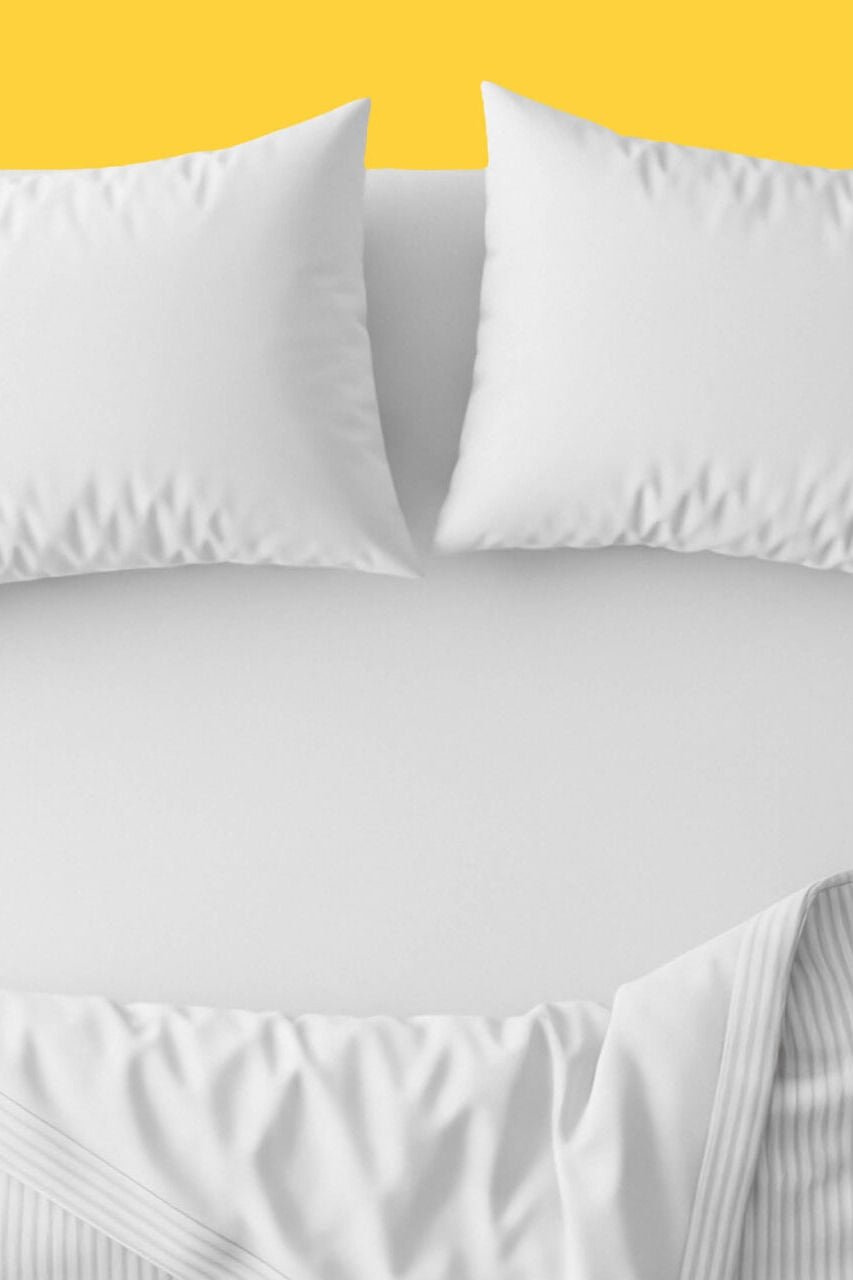 A bed with a yellow background