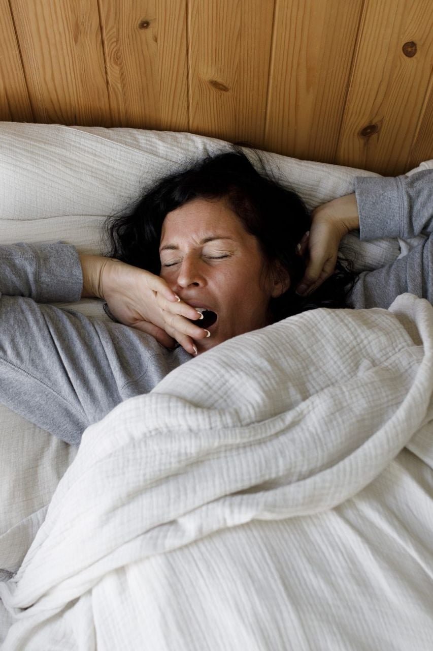 A woman yawning