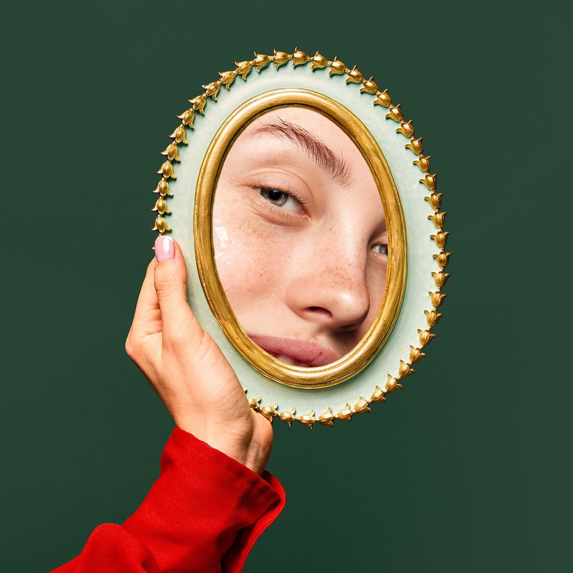 woman looking in mirror