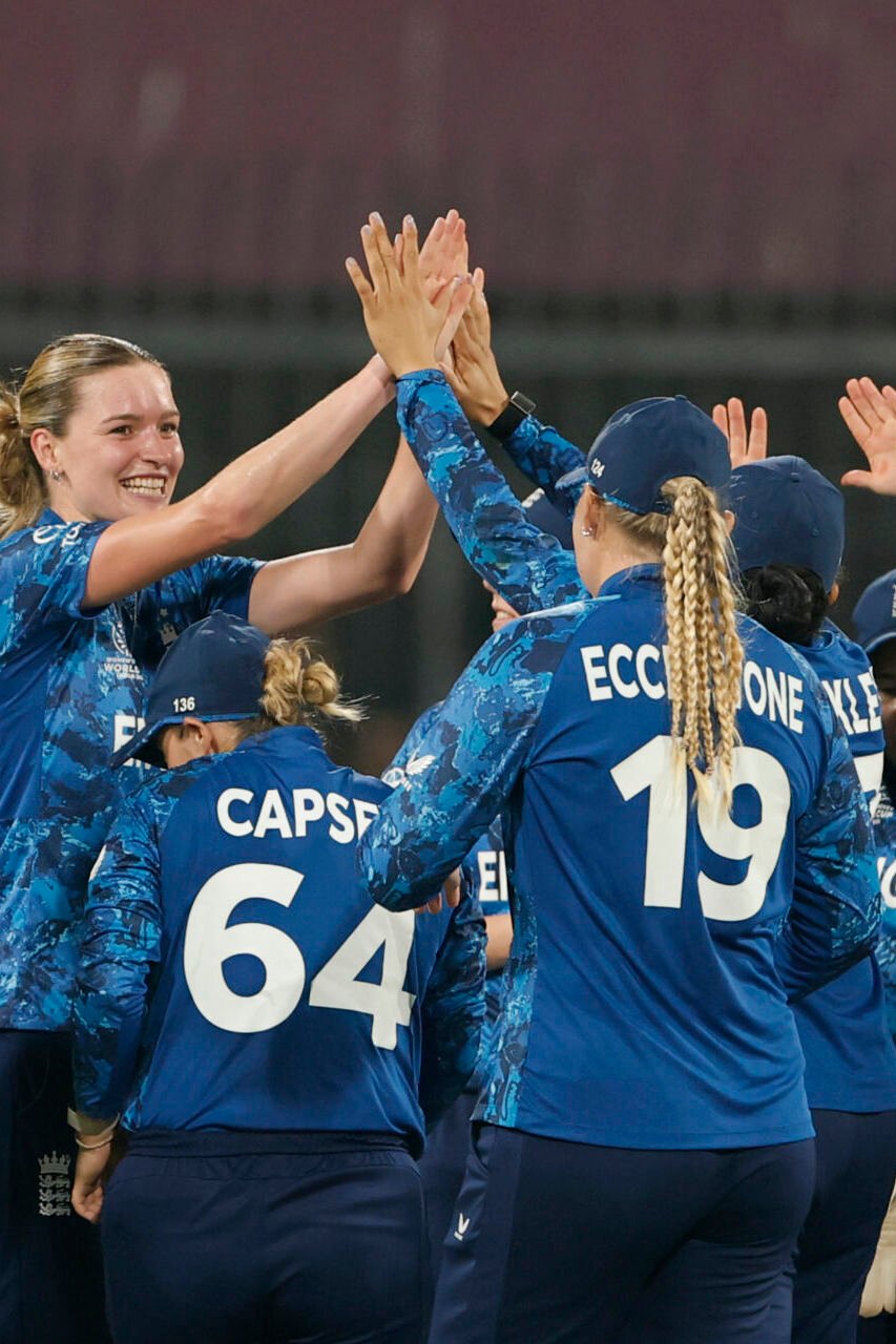 England players celebrate the wicket of Pratika Rawal of India during the ICC Women's Cricket World Cup India 2025 match between India and England at Holkar Cricket Stadium on October 19, 2025 in Indore, India.
