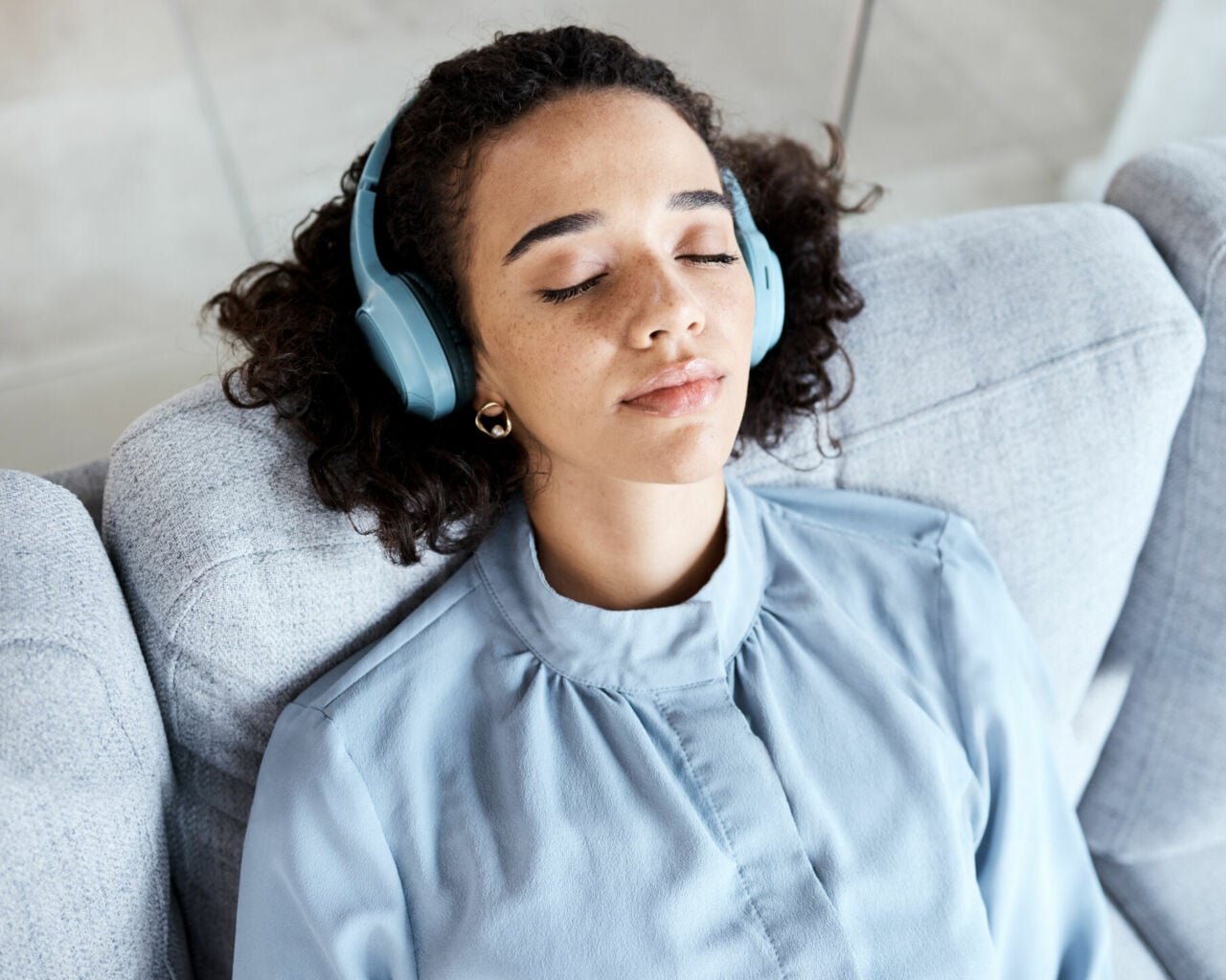 woman listening to podcast on headphones