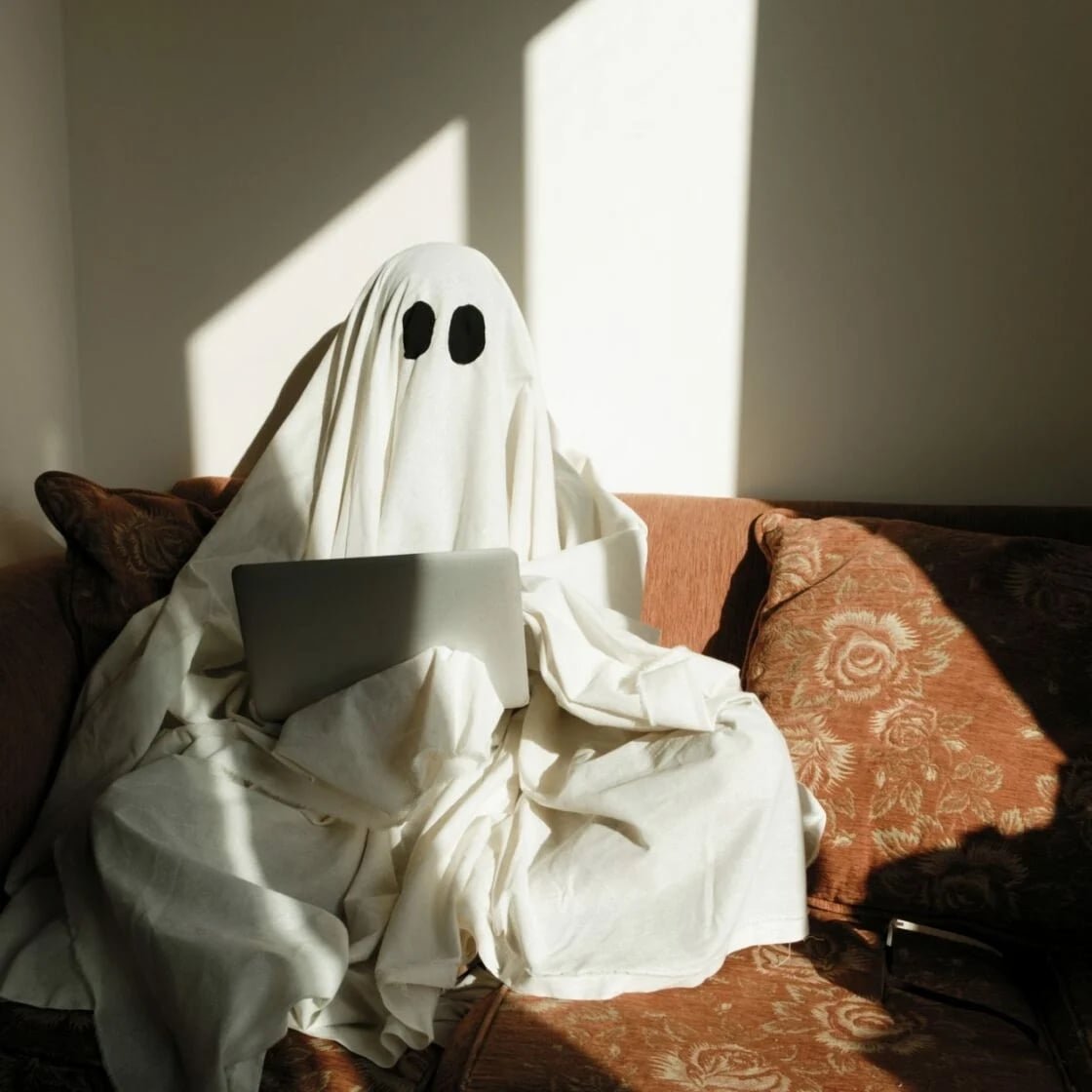ghost working on a laptop