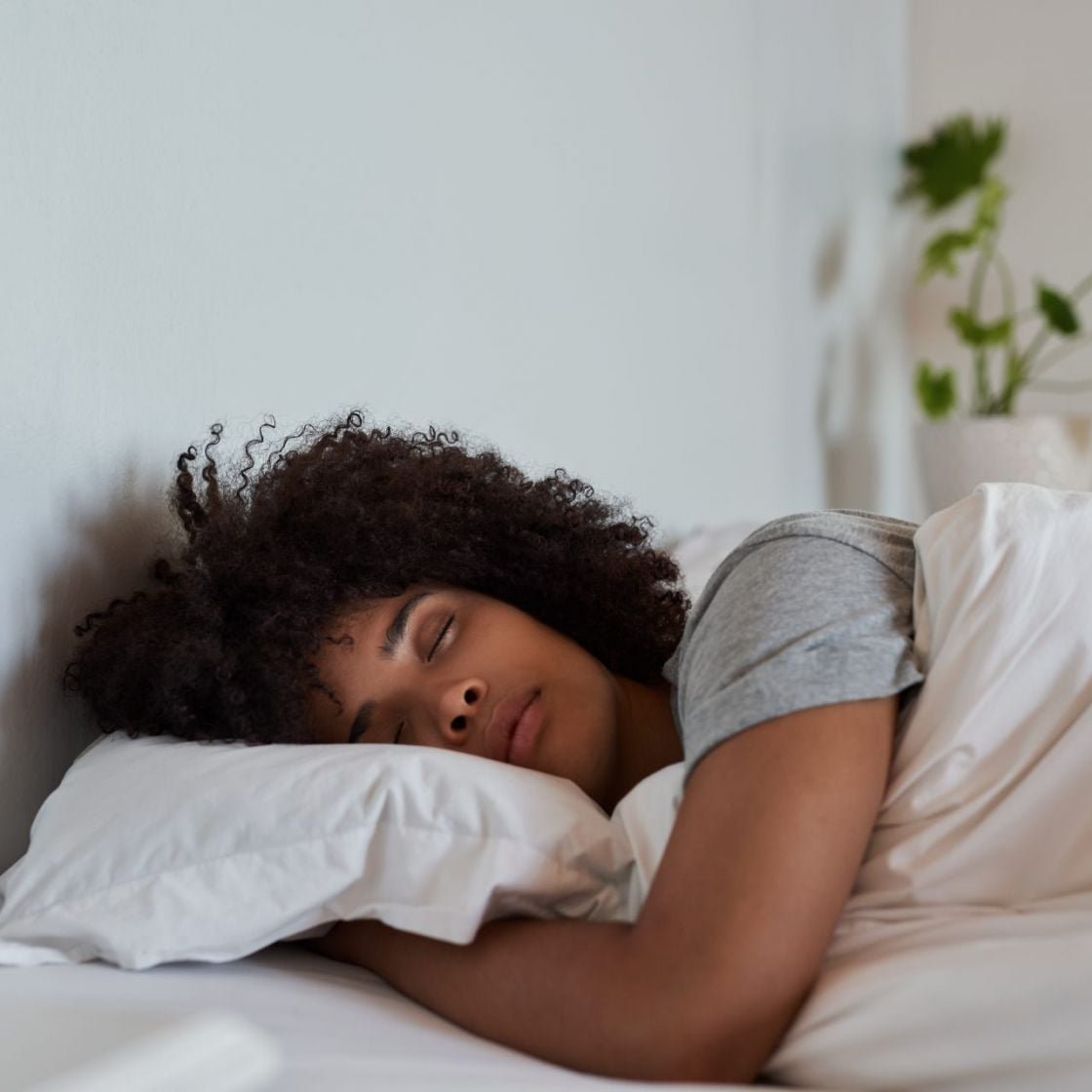 A woman sleeping in bed