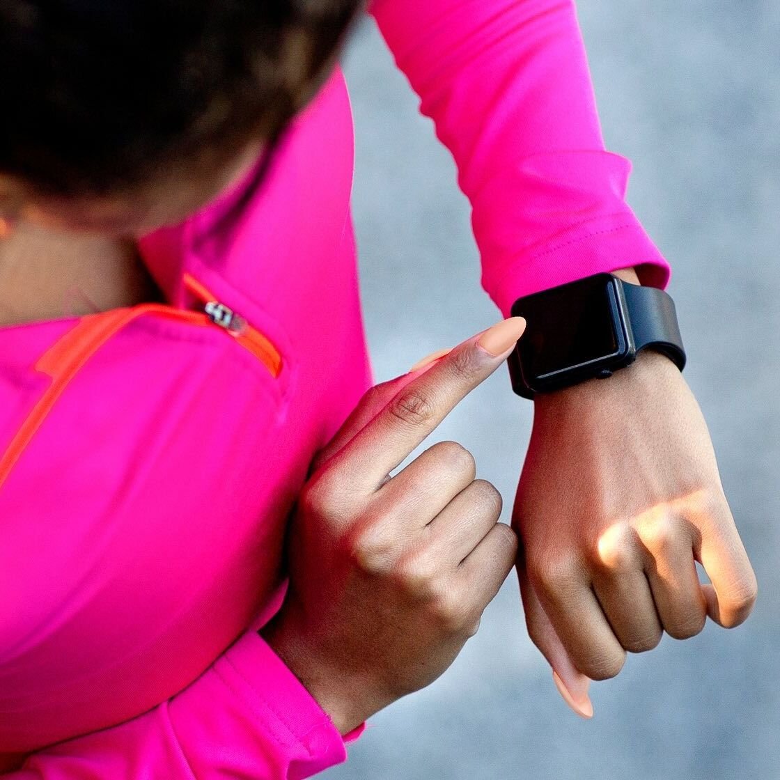 A woman looking at her health tracker
