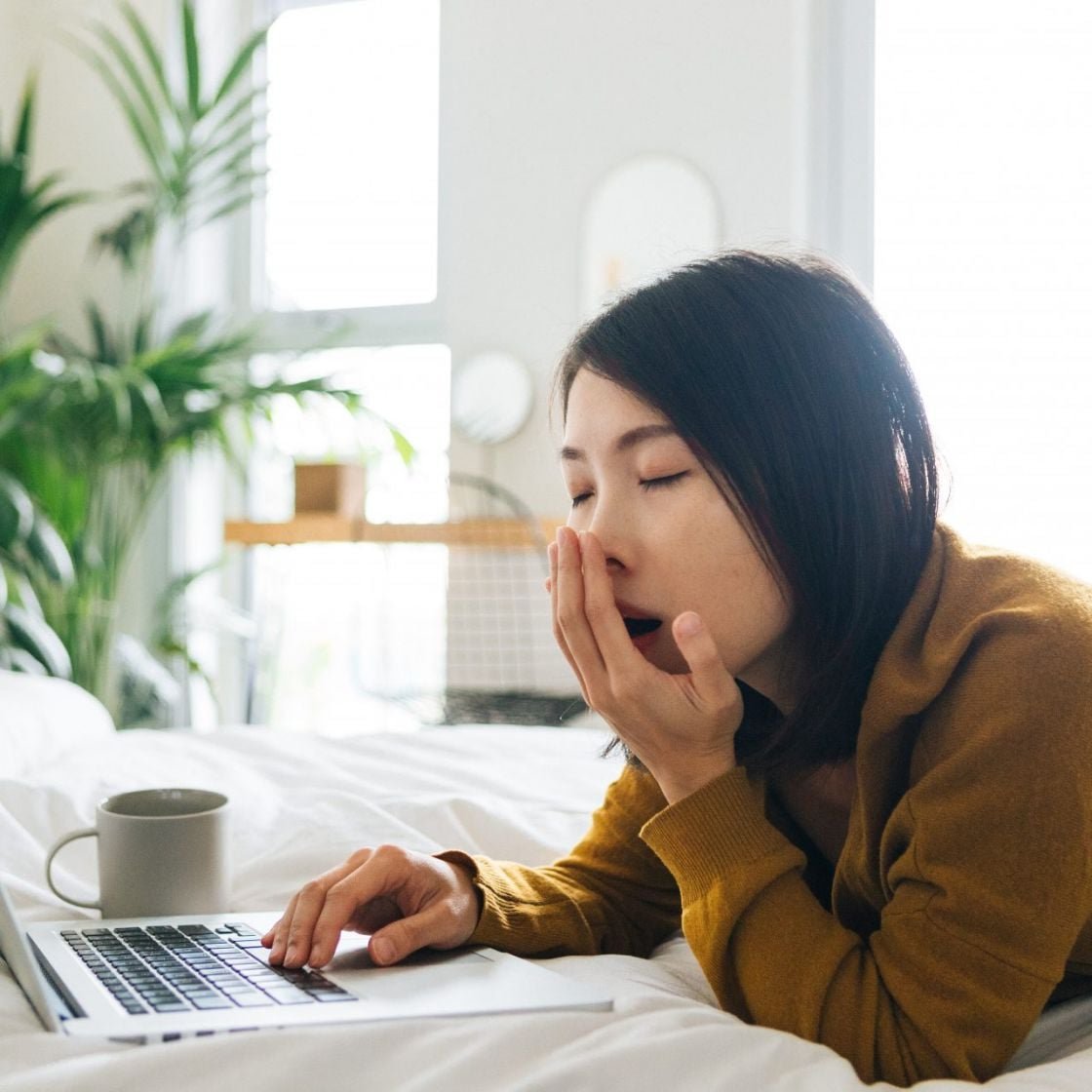 Tired woman yawning