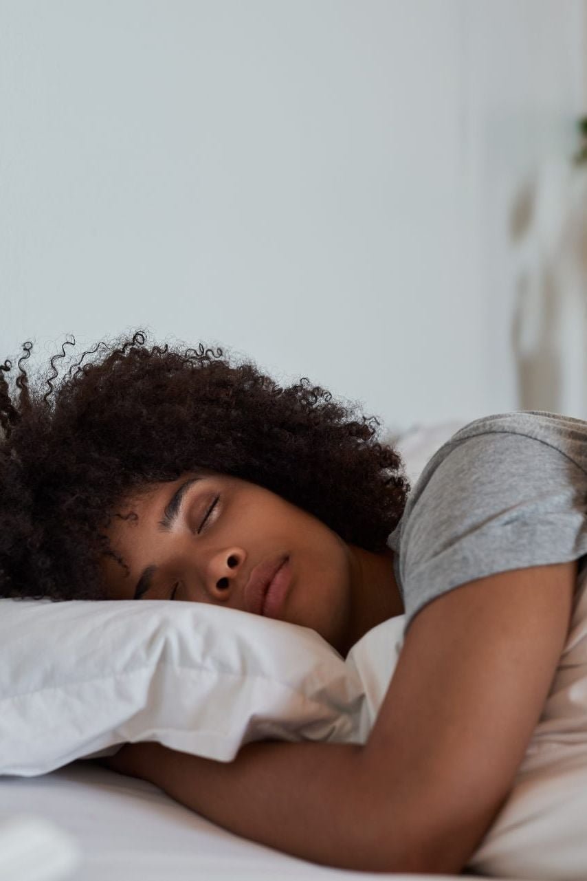 A woman sleeping in bed