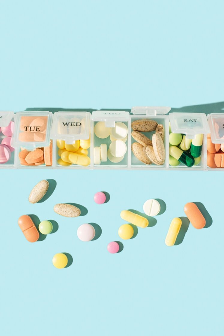 Pill box full of supplements