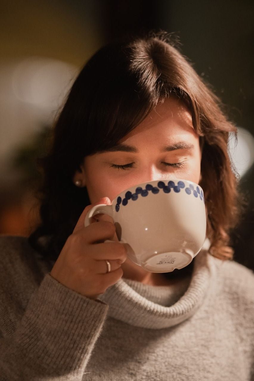 Woman drinking from a mug