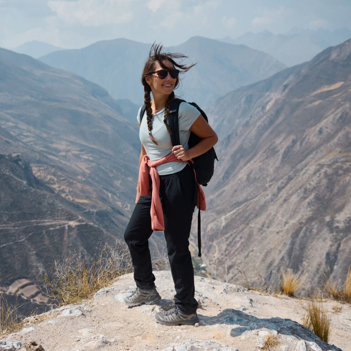 Image of a woman standing on a mountain