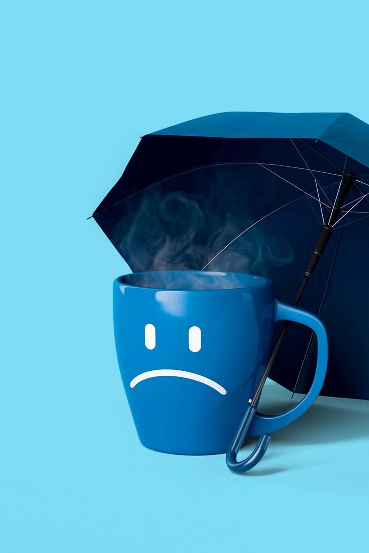An umbrella over a steaming mug