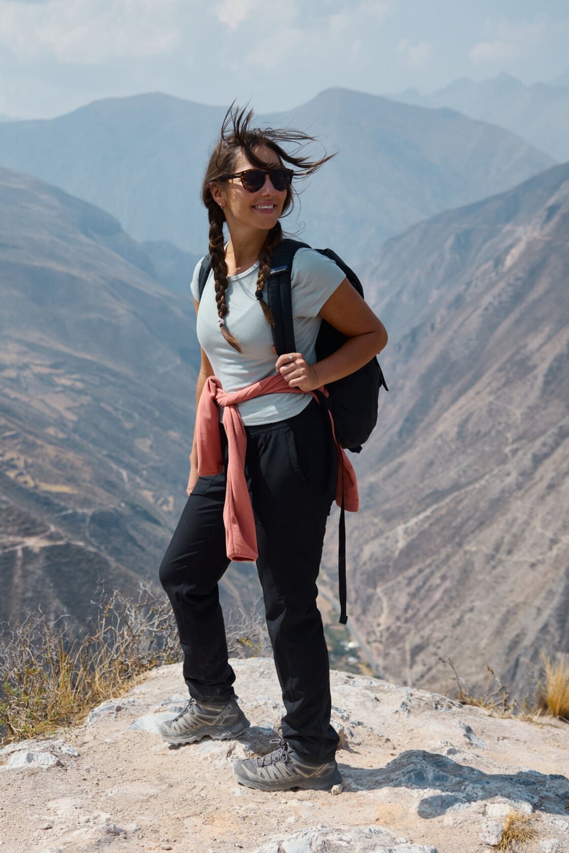 Image of a woman standing on a mountain