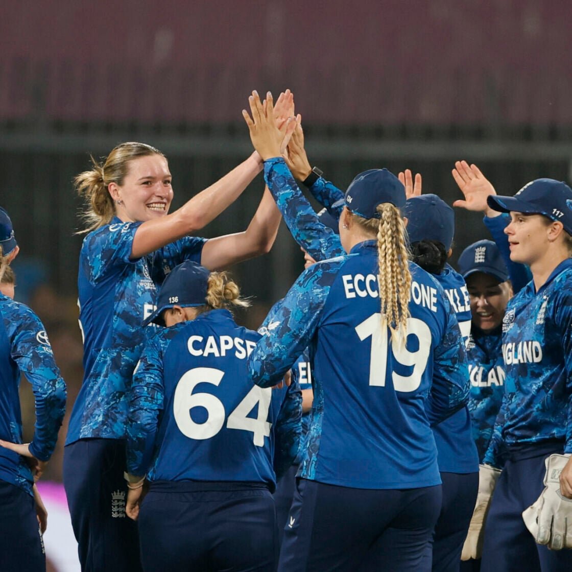 England players celebrate the wicket of Pratika Rawal of India during the ICC Women's Cricket World Cup India 2025 match between India and England at Holkar Cricket Stadium on October 19, 2025 in Indore, India.